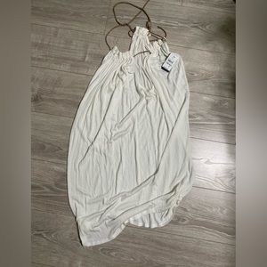 White dress with gold tassels